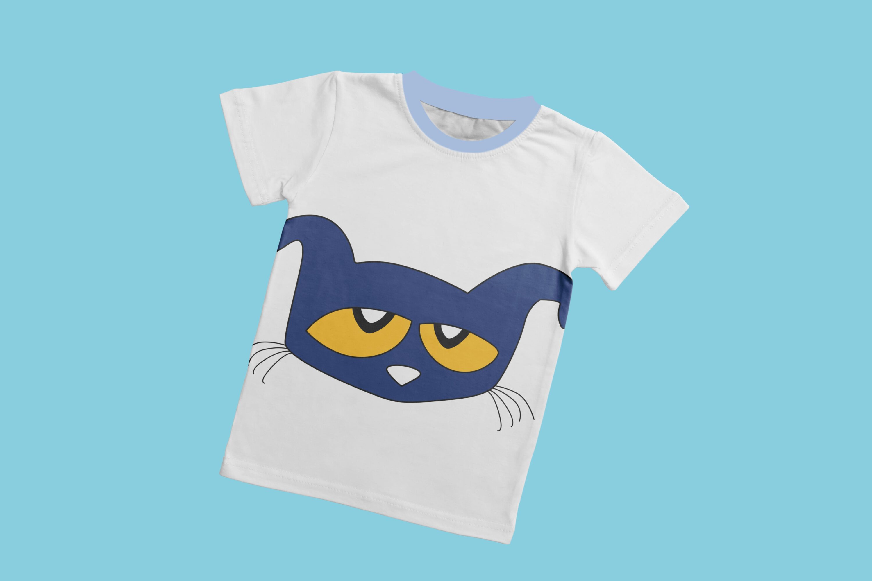 A white t-shirt with a light blue collar and the sad face of Pete the cat with yellow eyes.