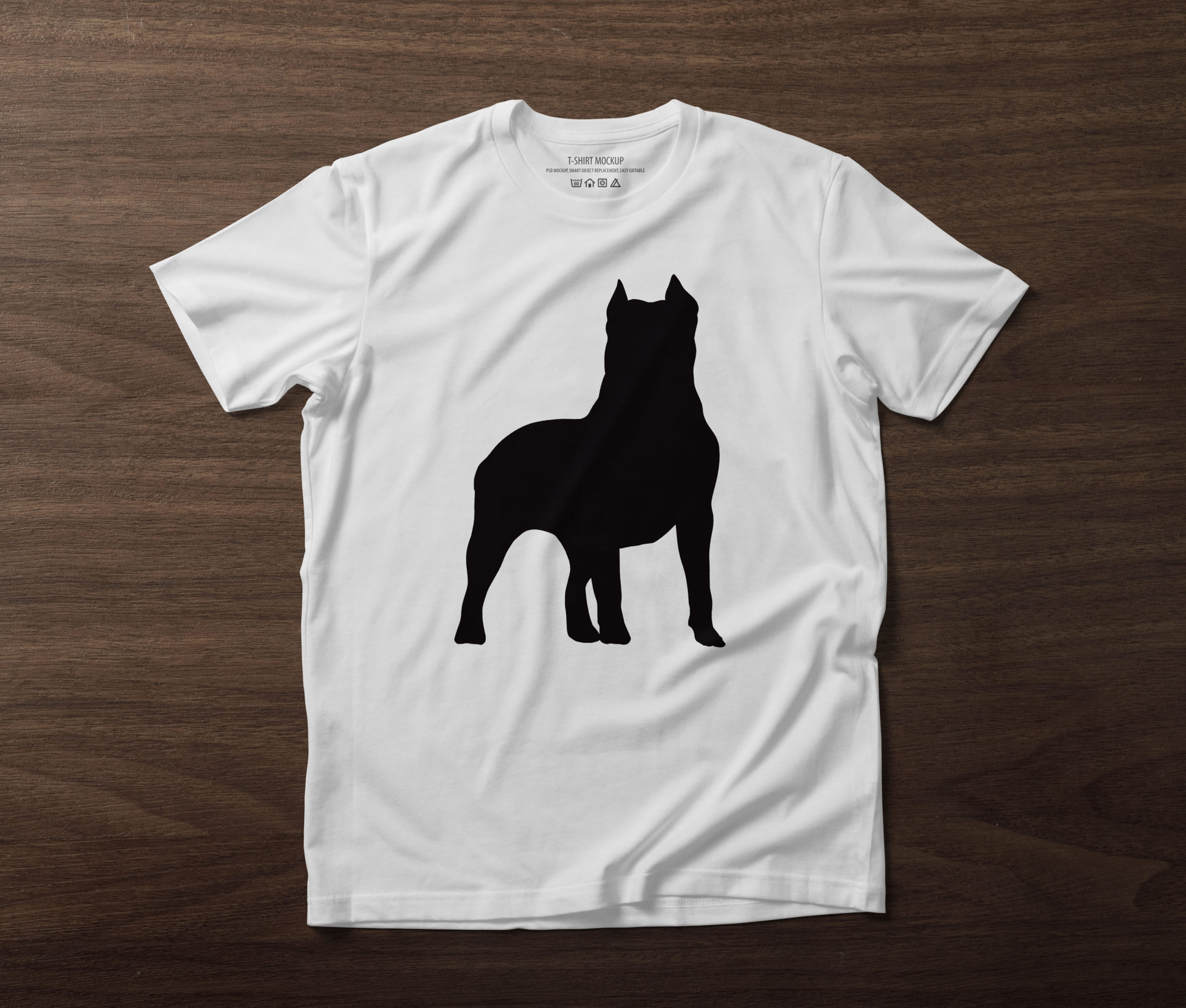 White T-shirt with a black silhouette of a pitbull on the table.