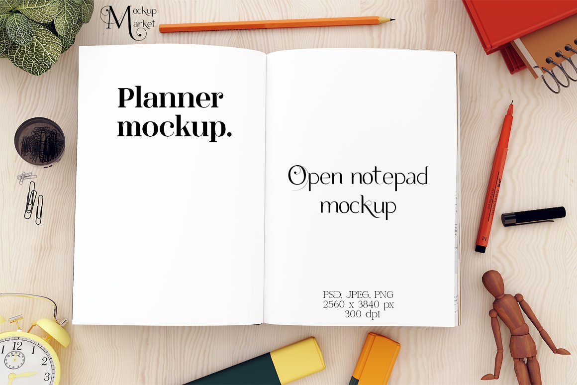 Planner mockup with white pages and black letterings "Planner mockup." and "Open notepad mockup" and different stationery on the table.