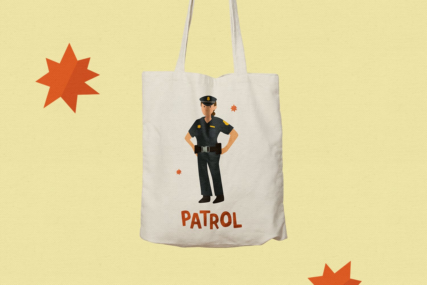 A white shopping bag featuring a female police officer in a black suit and black cap, with the orange lettering "Patrol".