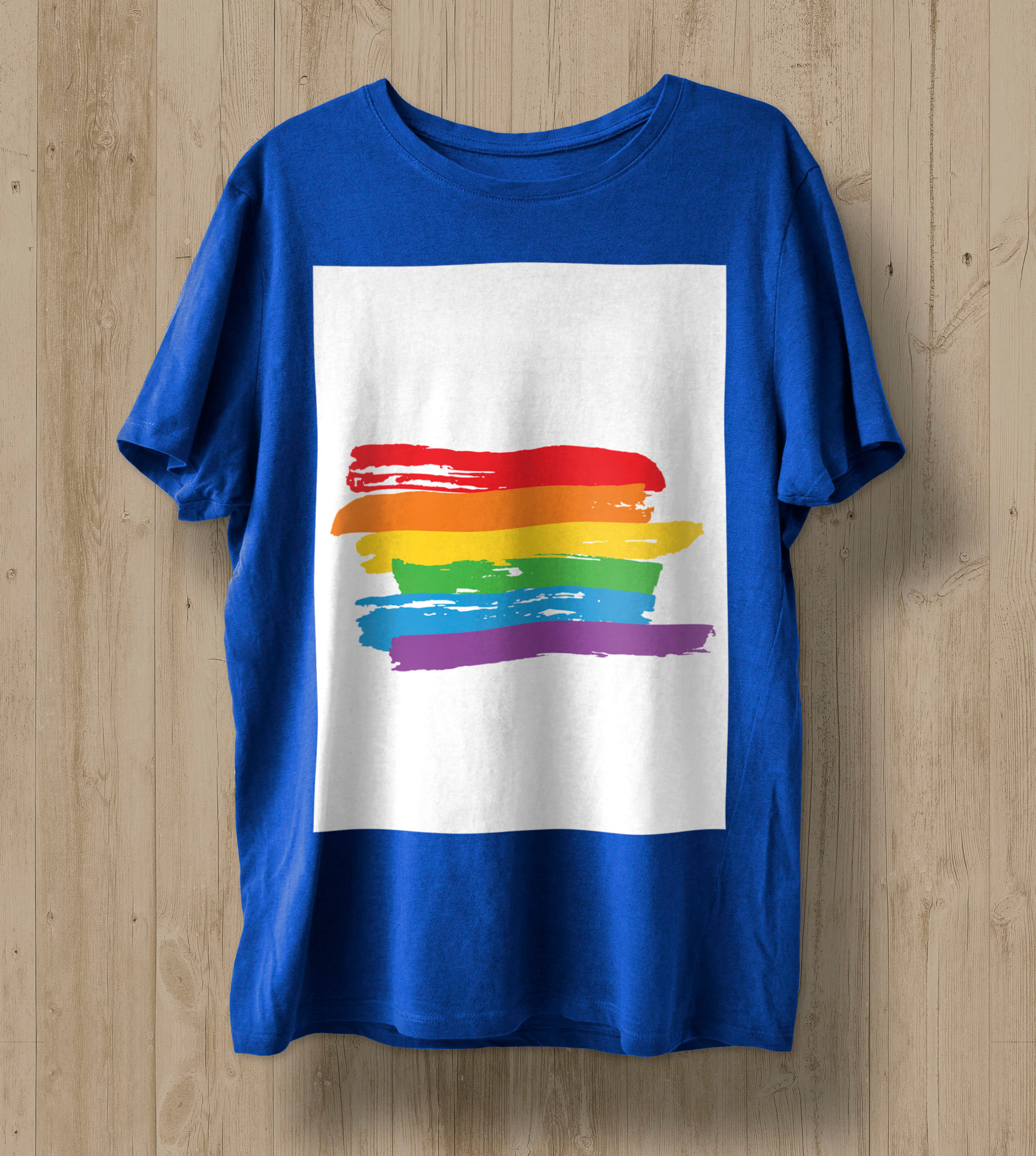 Blue T-shirt with lines in the colors of the LGBT flag in a white rectangle.