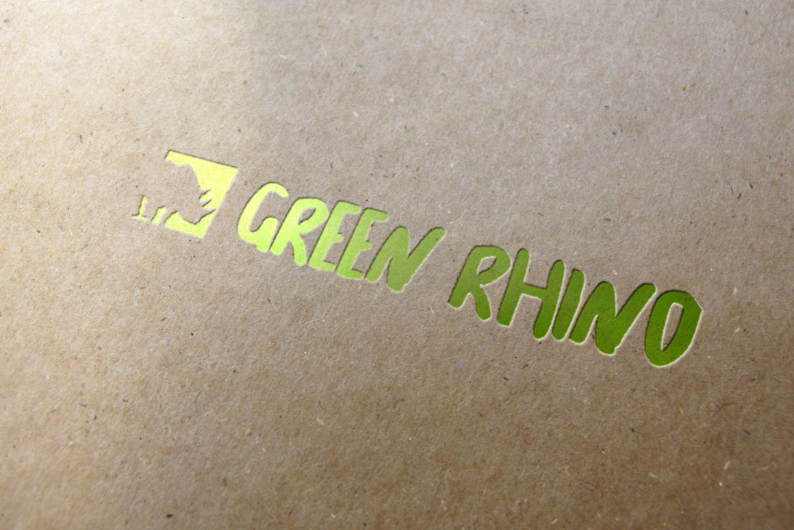Matte beige piece of paper with the glance green lettering.