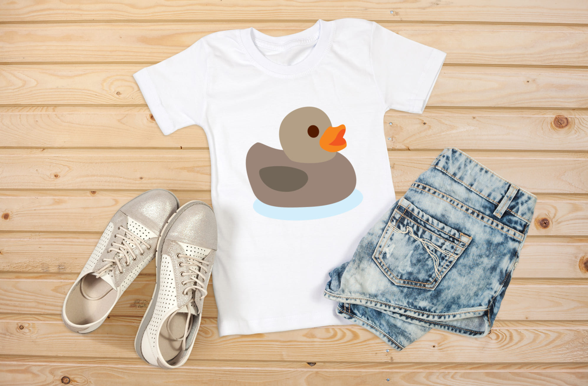 Picture of a white t-shirt with a unique rubber duck print in gray