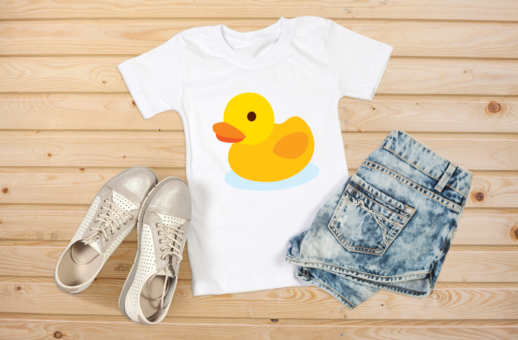 Image of a white t-shirt with an enchanting yellow rubber duck print.