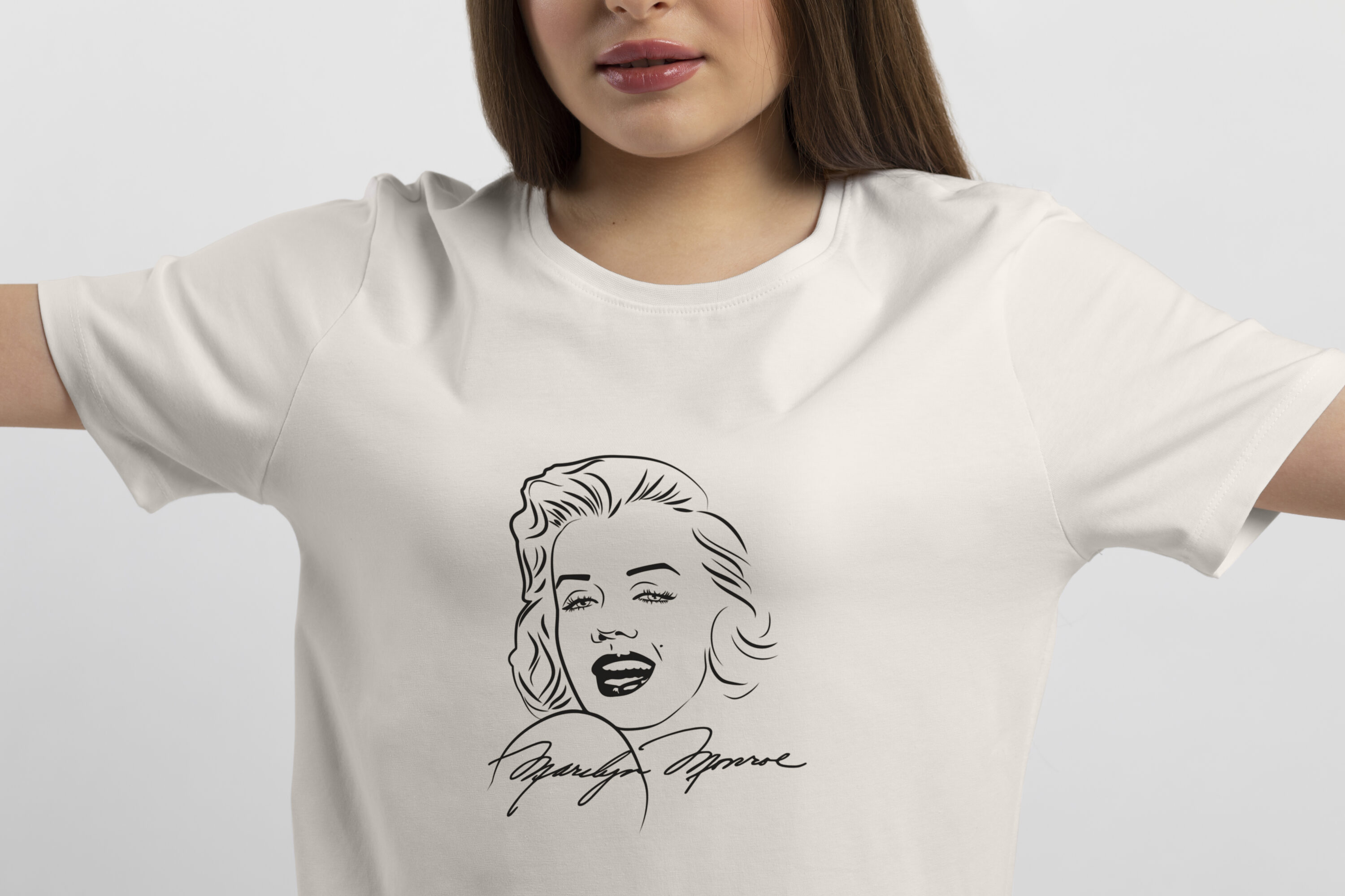 Image of a white t-shirt with a wonderful print of Marilyn Monroe and her signature.
