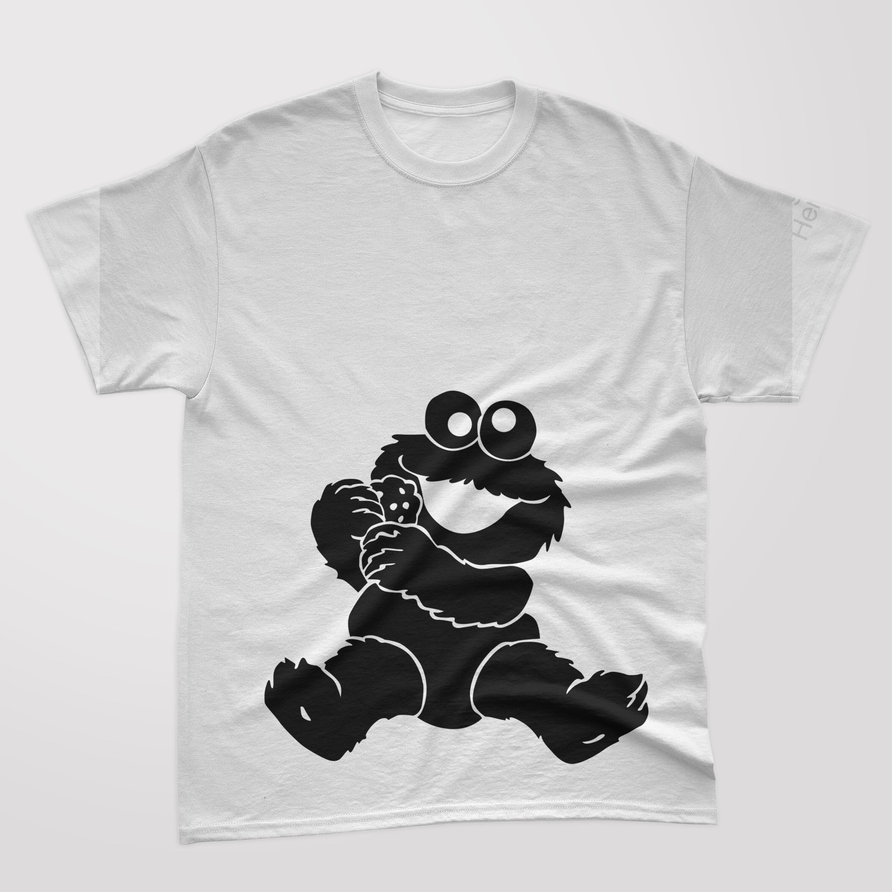 A white t-shirt with a black silhouette baby cookie monster, holding a cookie.