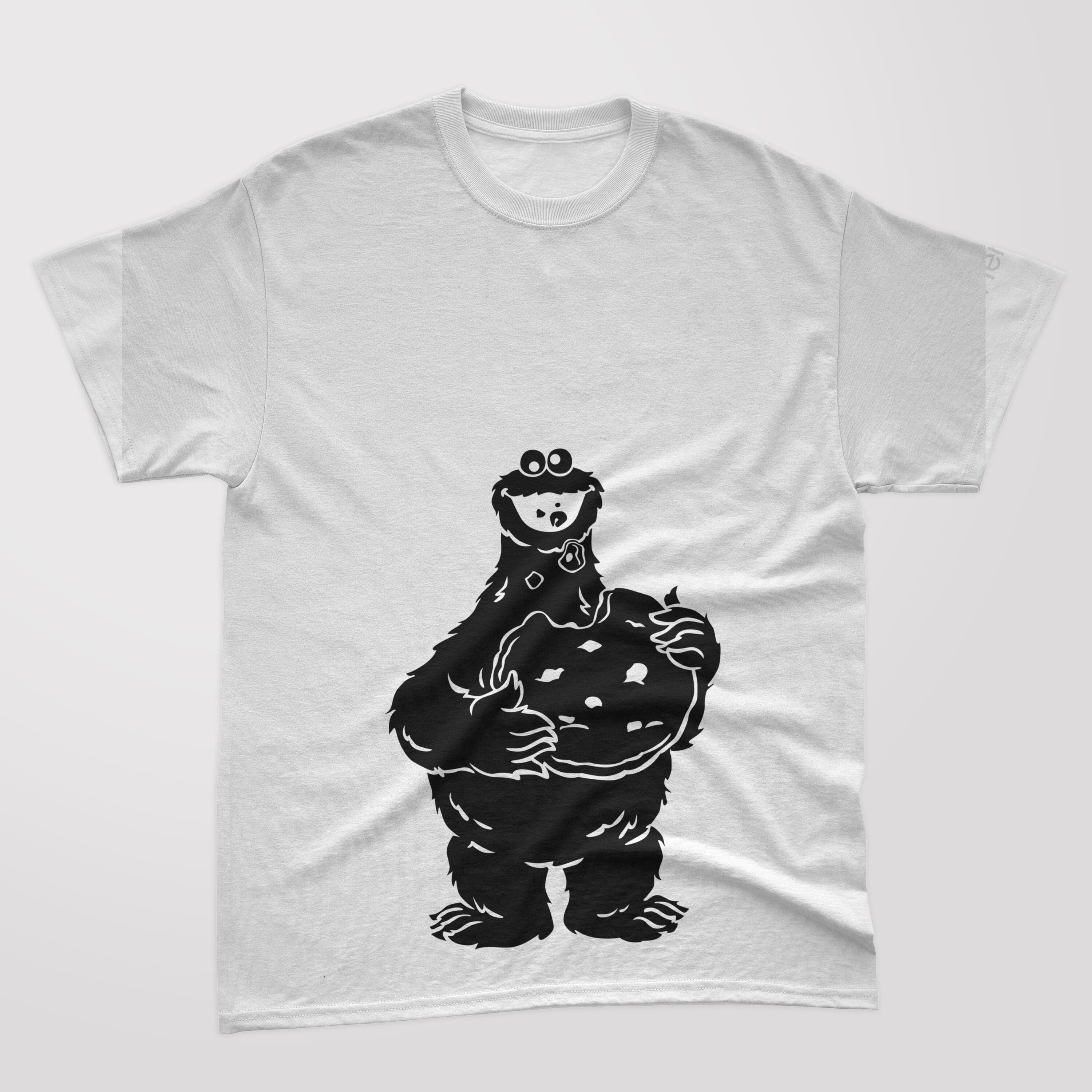 A white t-shirt with a black silhouette of a cookie monster that eats food.
