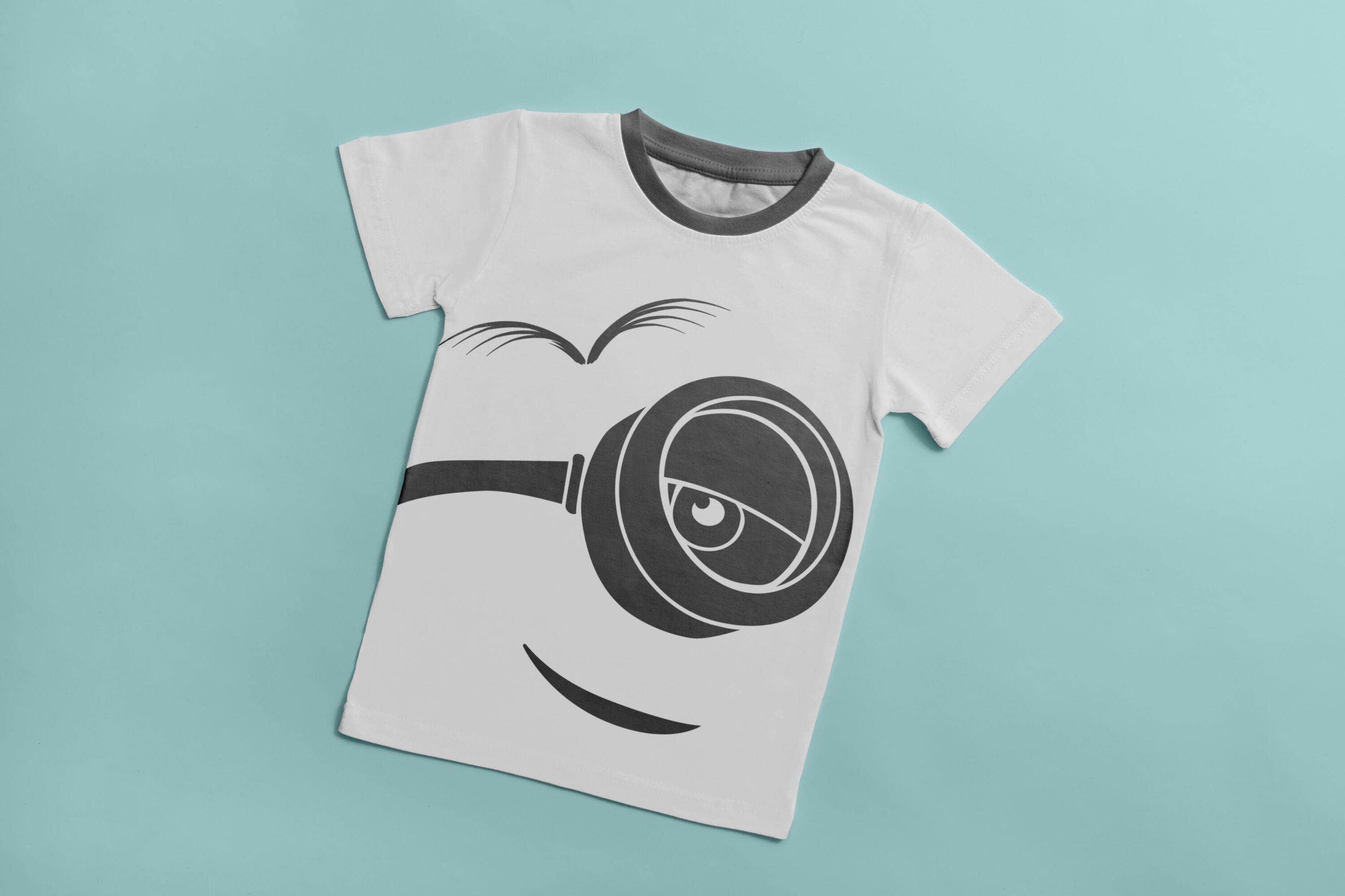 White T-shirt with a gray collar and a gray silhouette of a grinning minion.