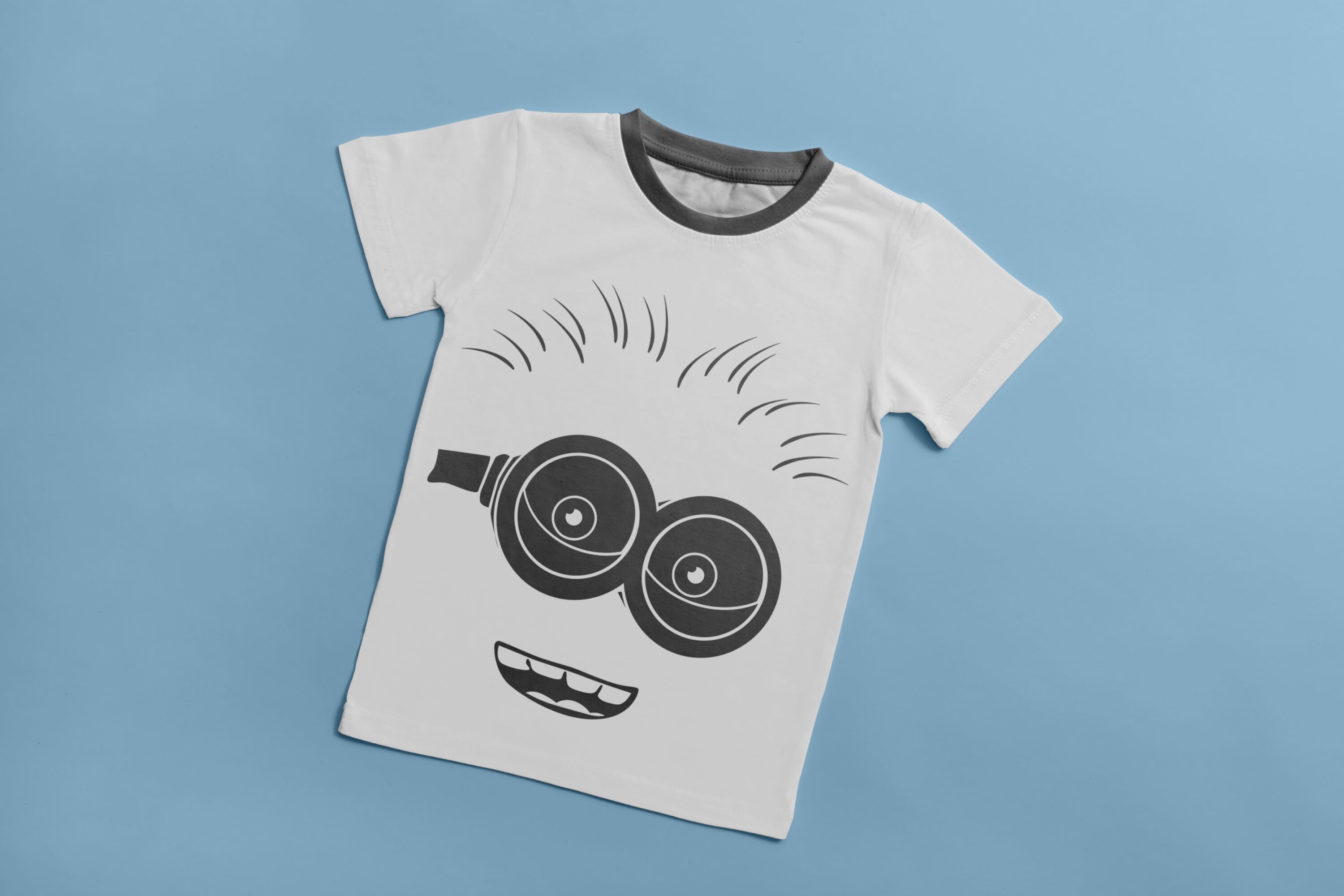 A white T-shirt with a gray collar and a gray silhouette of a laughing minion.