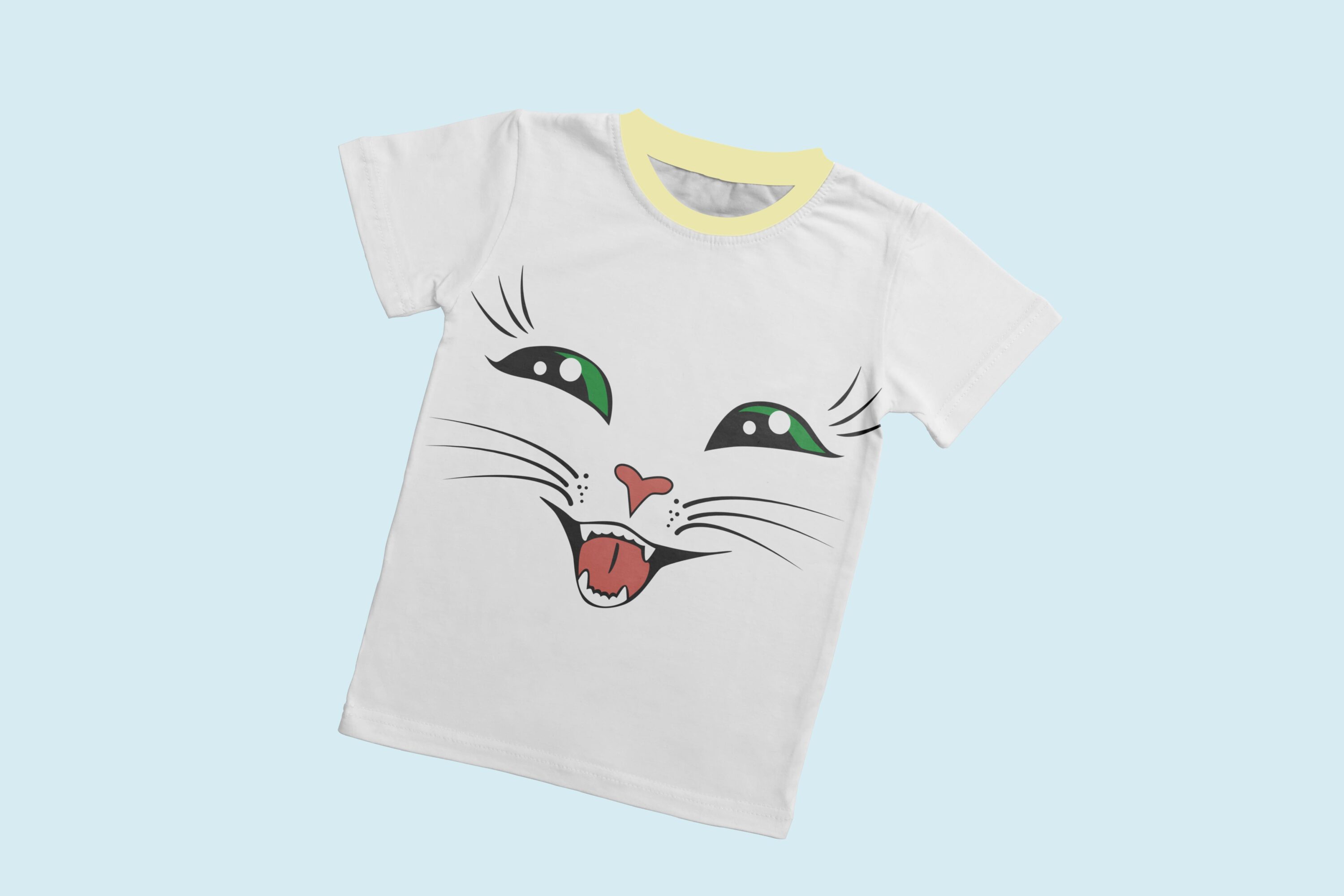 A white t-shirt with a light yellow collar and the face of a laughing cat with green eyes.