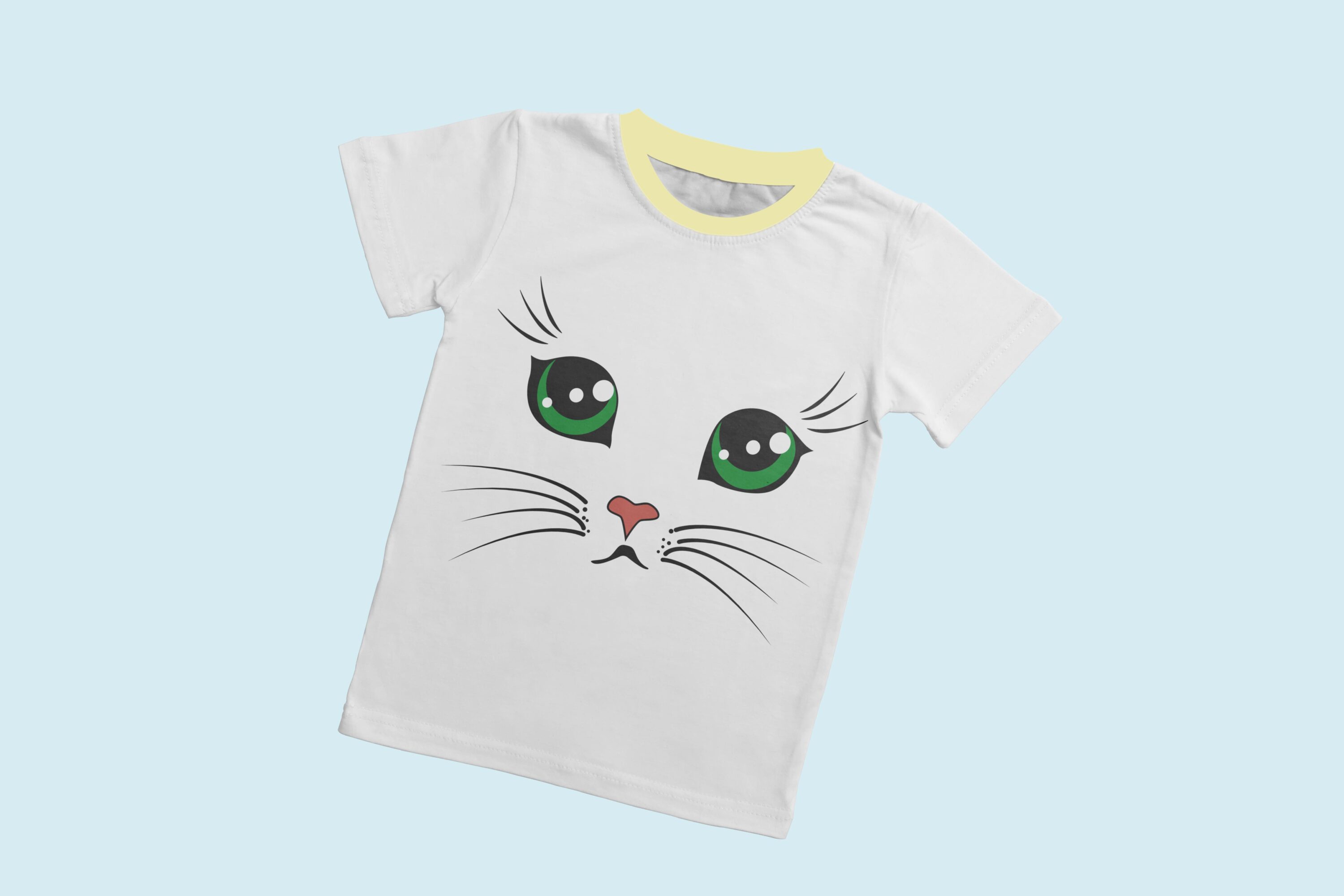 A white T-shirt with a light yellow collar and the face of an offended cat with green eyes.