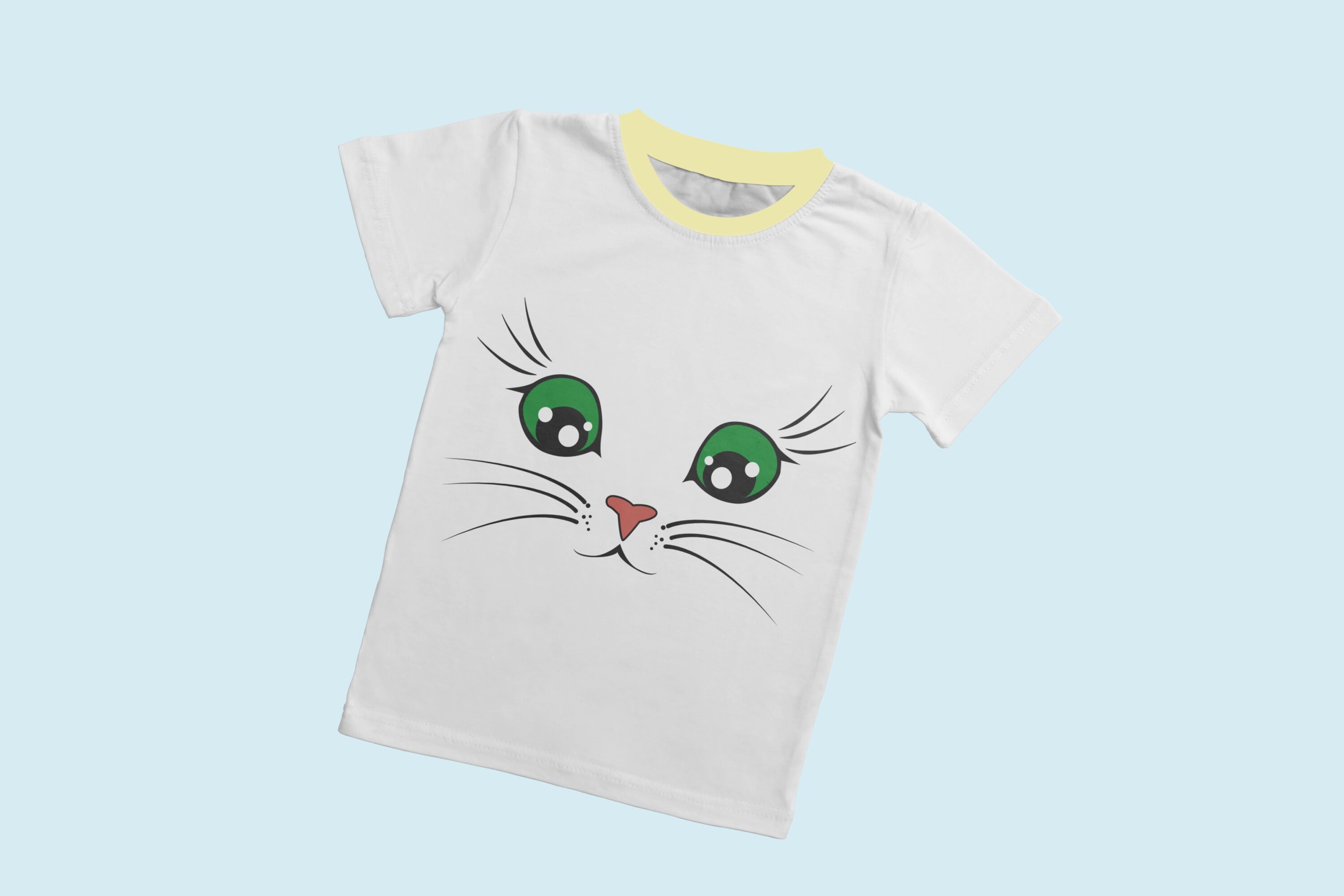 A white T-shirt with a light yellow collar and the face of an admiring cat with green eyes.