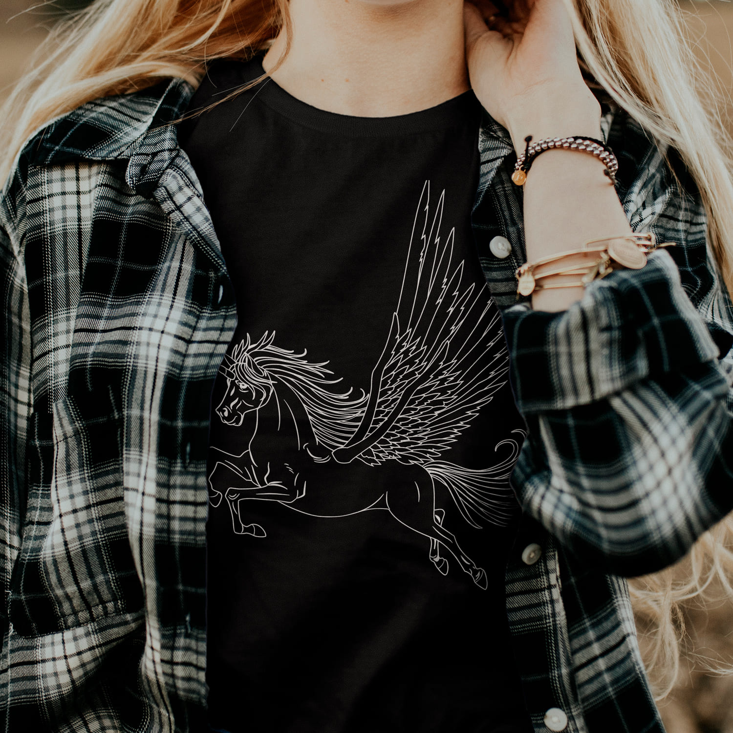 Black t-shirt with the simple unicorn print.