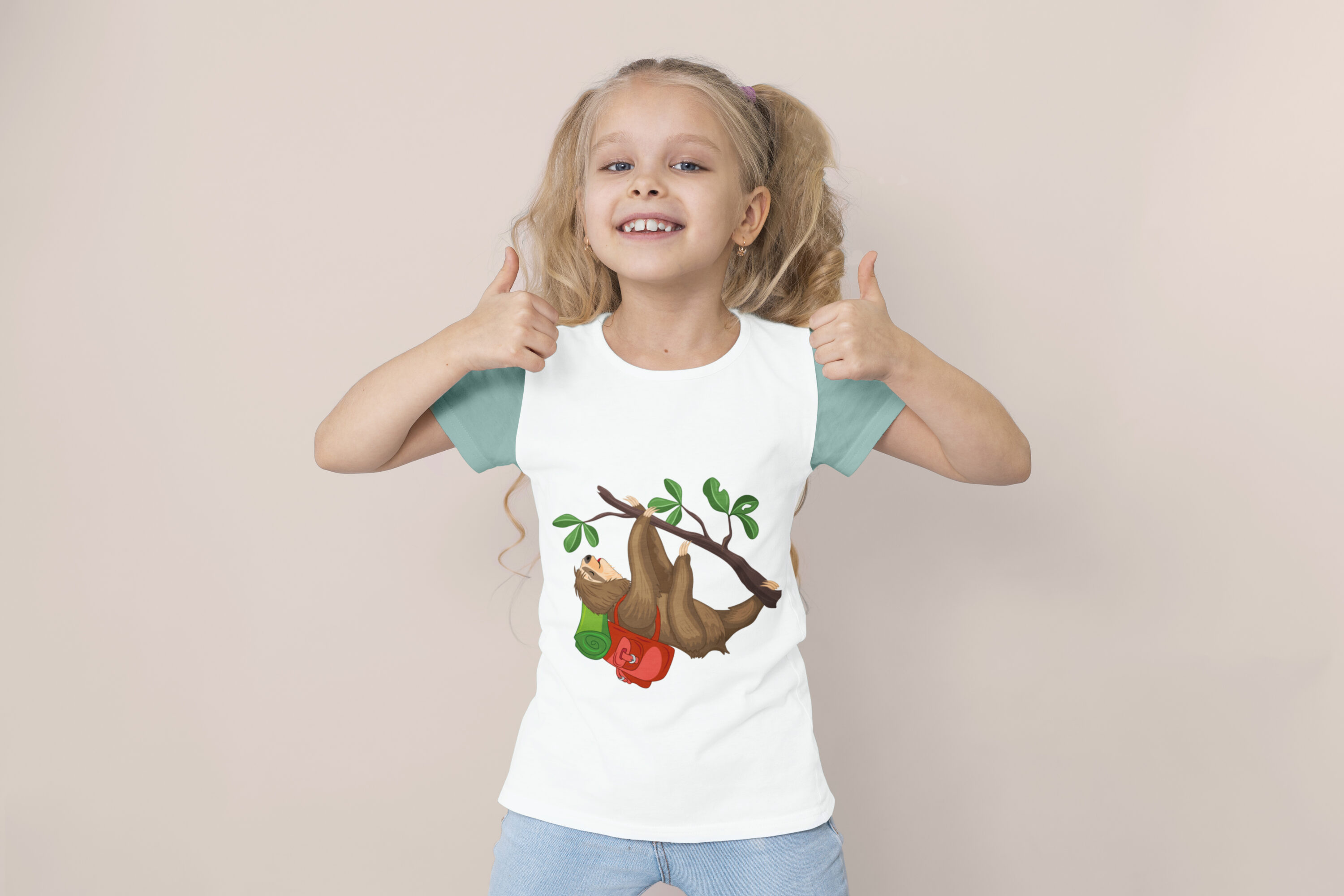 Image of a t-shirt on a child with a cute sloth print with a backpack.