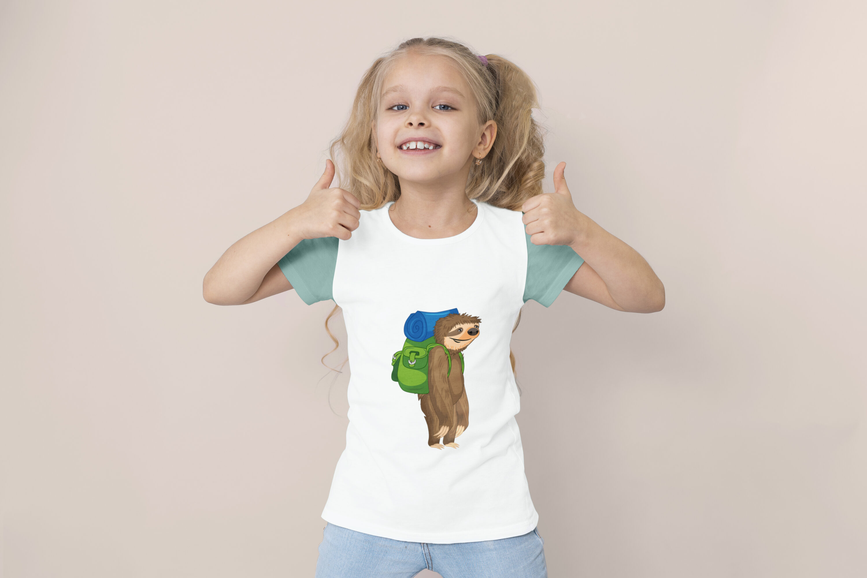 Image of a t-shirt on a child with a unique sloth print with a backpack.
