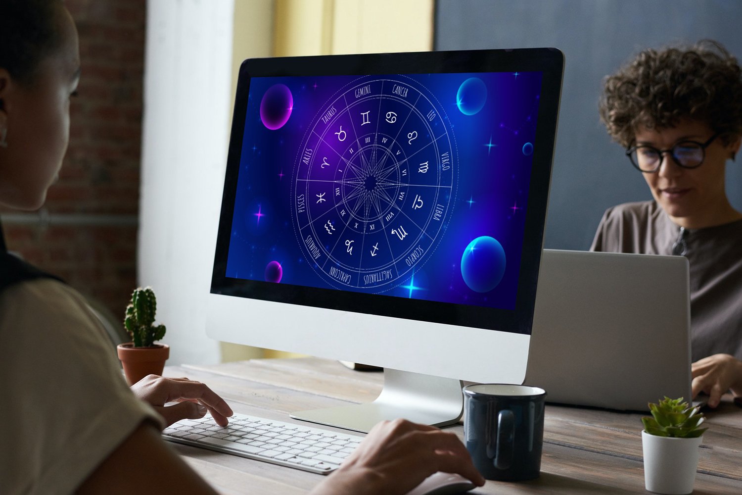 Purple zodiac wheel on a desktop display.