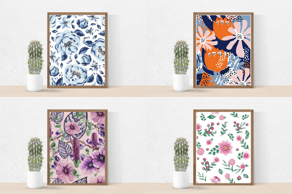 Cactus in a pot and 4 different pictures in brown frames - blue and light blue flowers on a white background, orange and pink flowers with blue twigs on a dark blue background, purple flowers on a lavender background and pink flowers with green twigs on a white background.