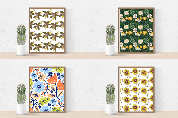 Cactus in a pot and 4 different pictures in brown frames - golden and olive flowers on a white background, white and yellow daisies on a dark green background, colorful flowers on a white background, and yellow and pink flowers on a white background.