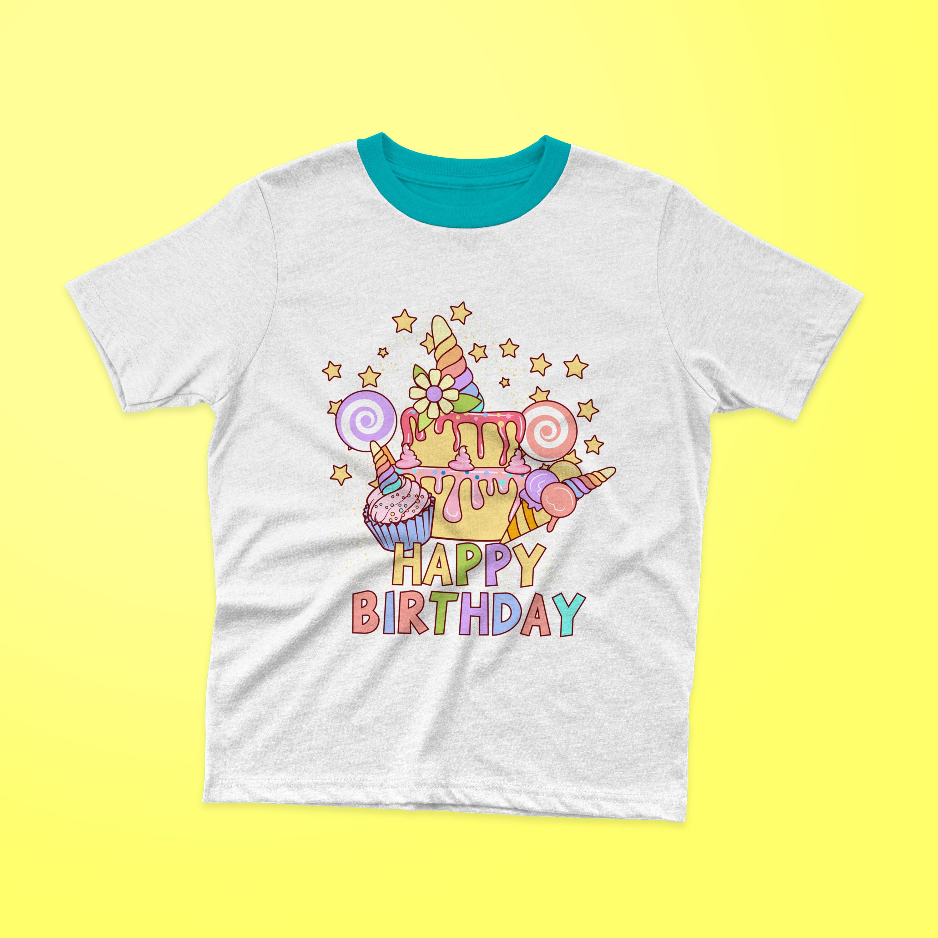 White t-shirt with a turquoise collar and a birthday cake with colorful lettering "HAPPY BIRTHDAY" on a yellow background.