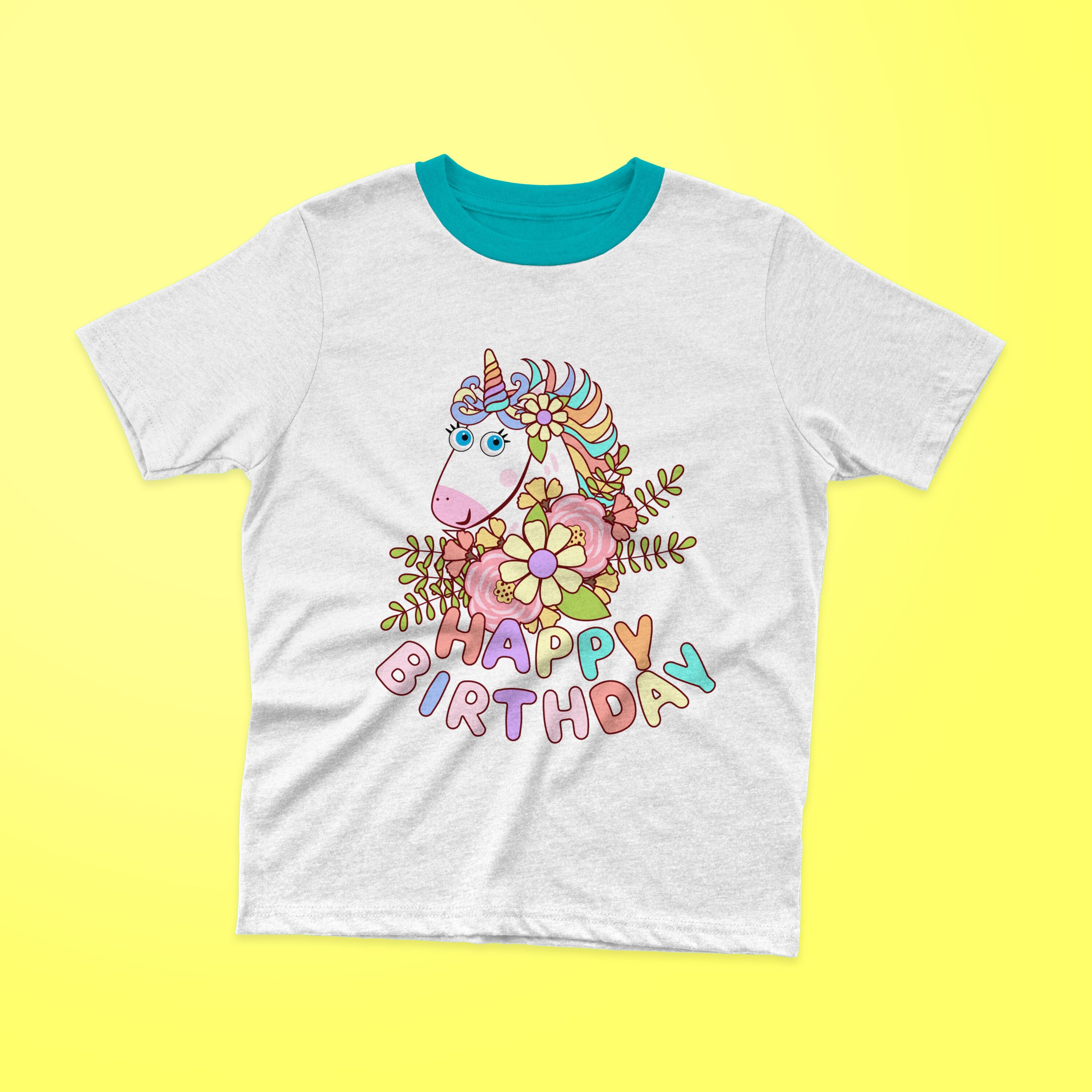 White t-shirt with a turquoise collar and a cute unicorn with colorful lettering "HAPPY BIRTHDAY" on a yellow background.