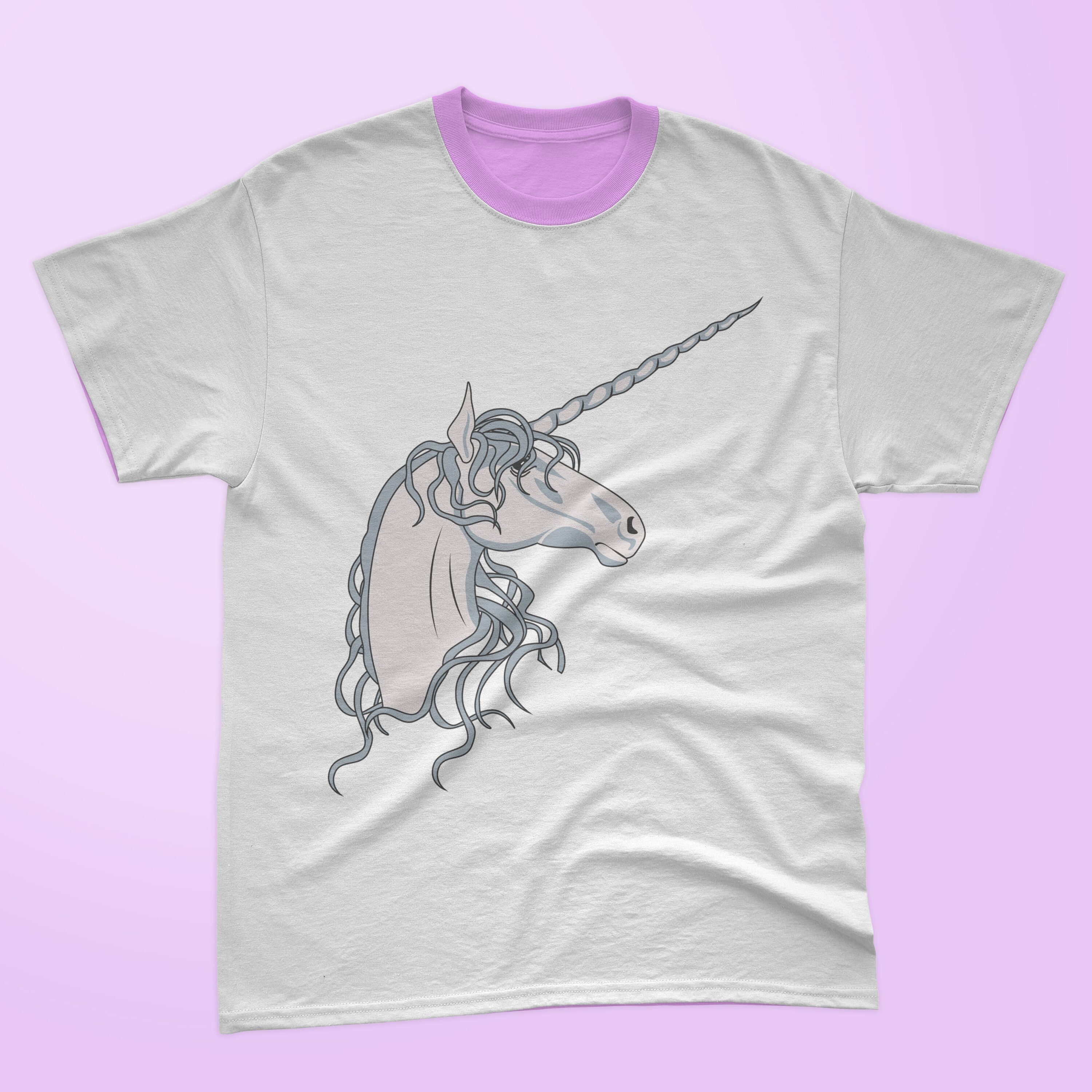 White t-shirt with a lavender collar and unicorn head on a lavender background.