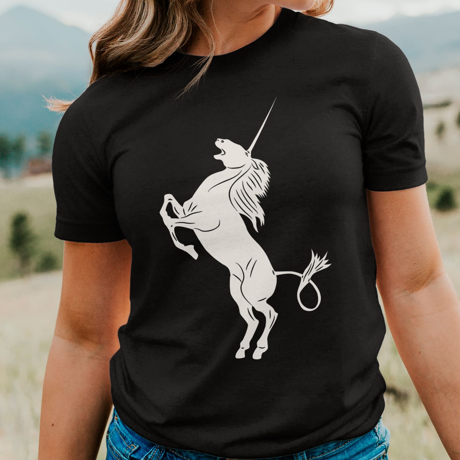 Black t-shirt with white unicorn silhouette.