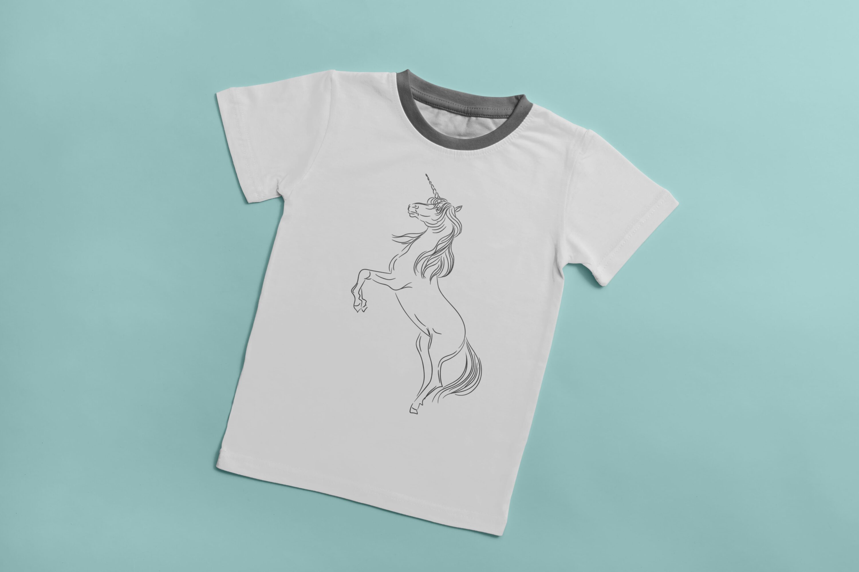 White t-shirt with a gray collar and a gray silhouette of a unicorn on a light blue background.