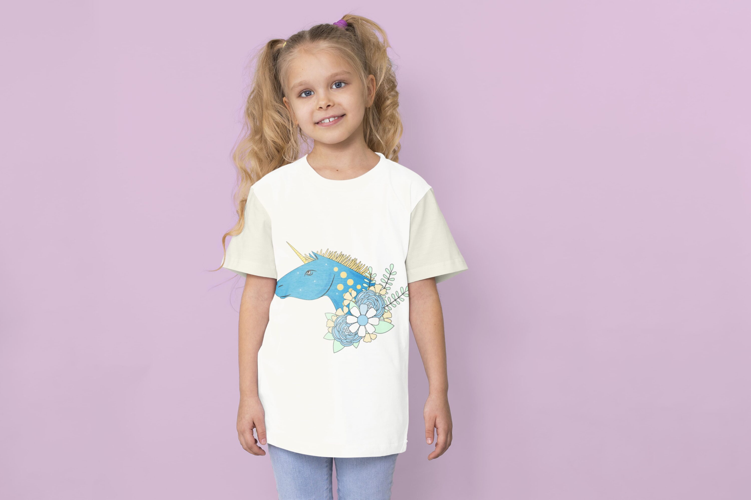 A white t-shirt with a blue unicorn face on a girl on a lavender background.