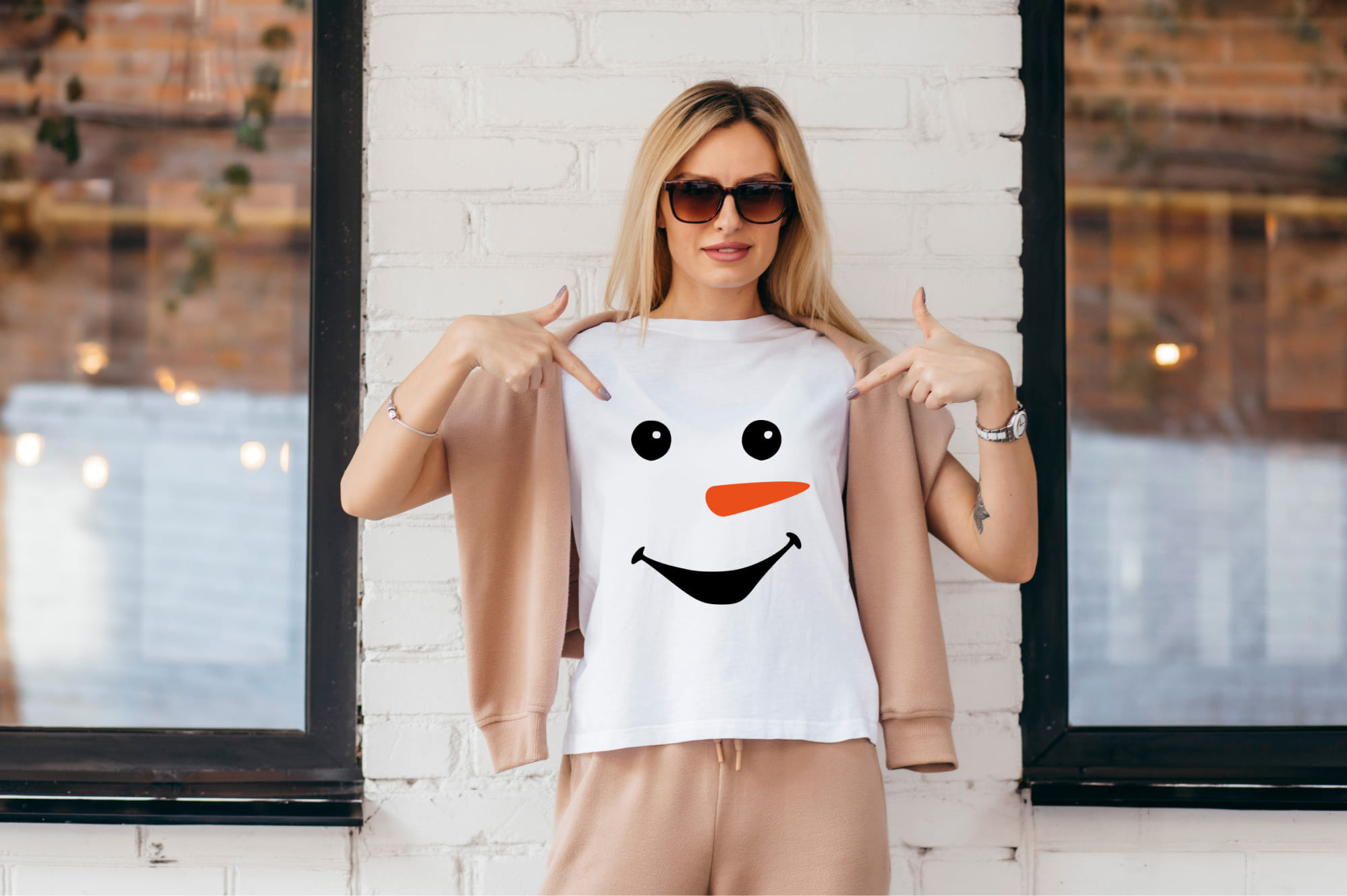 Simple snowman face on a white t-shirt.