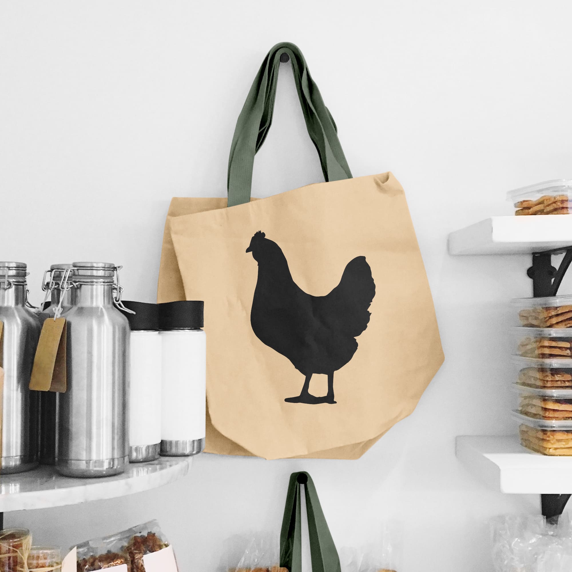 Bag with a chicken on it hanging on a wall.
