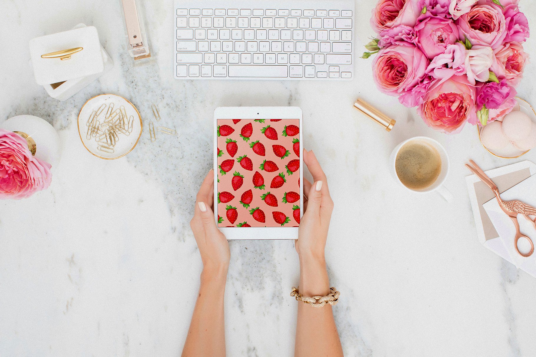 Mockup of iPad with pink pattern of strawberry.