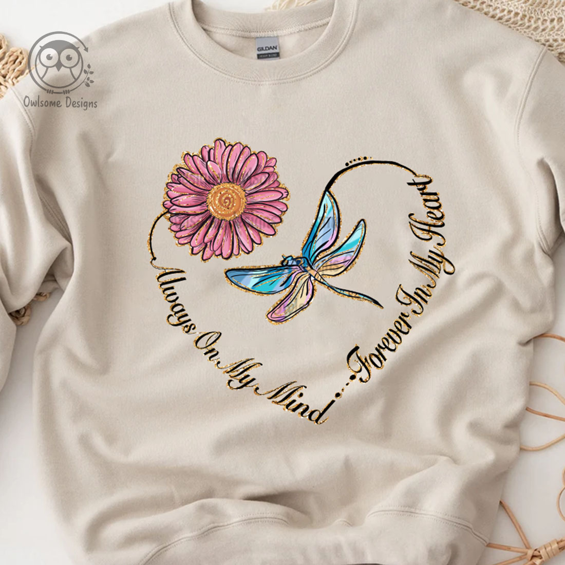Image of a sweatshirt with a gorgeous dragonfly and heart-shaped flower print.