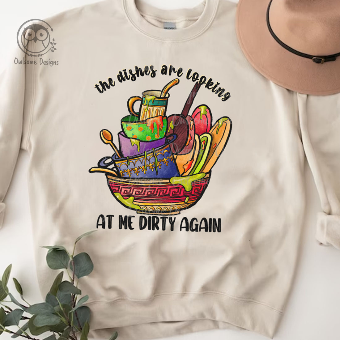 Image of a sweatshirt with a unique print of a mountain of dirty dishes.