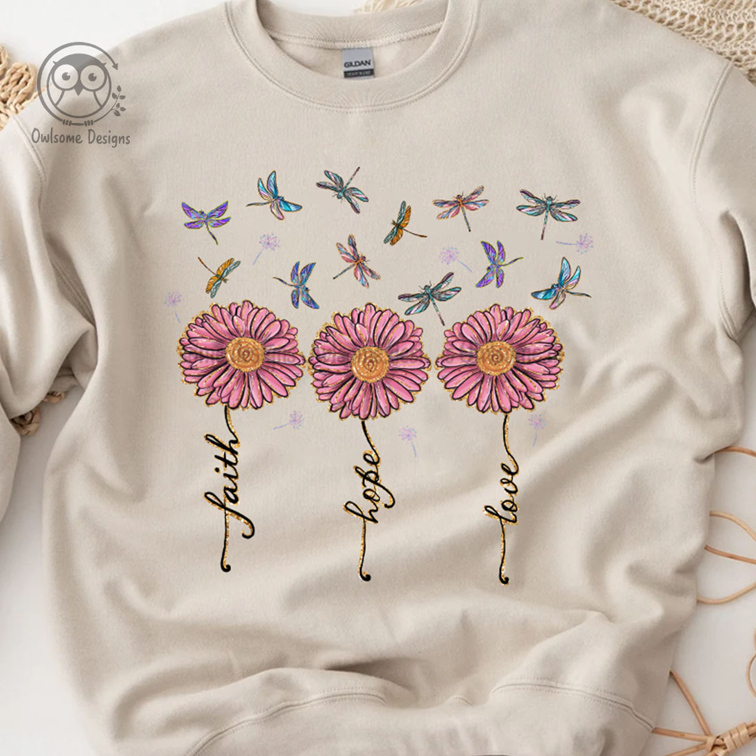 Image of sweatshirt with enchanting dragonfly print and flowers.