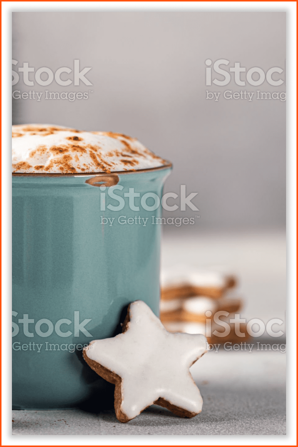 Photo of a Eggnog with cinnamon and cacao in a mug.