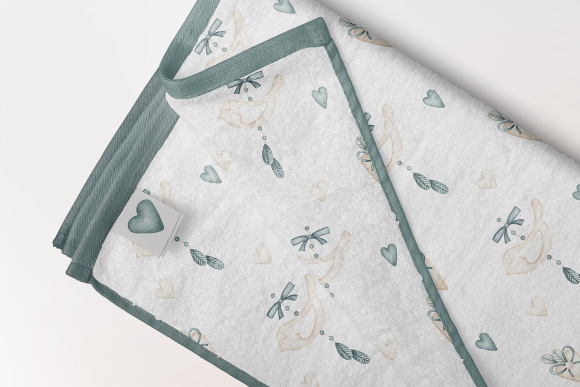 Textil with illustration of a bird and turquoise edging.