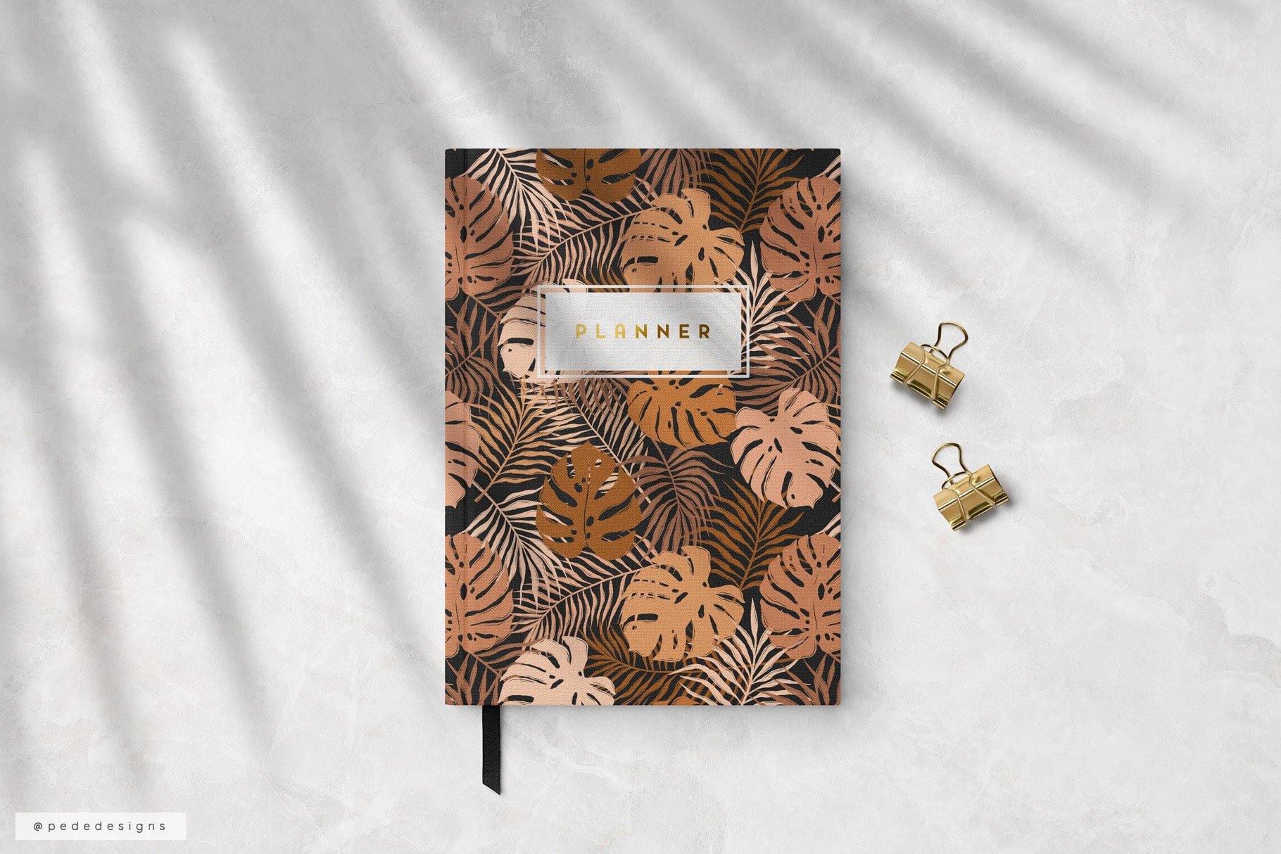 Notebook with the brown leaves cover.