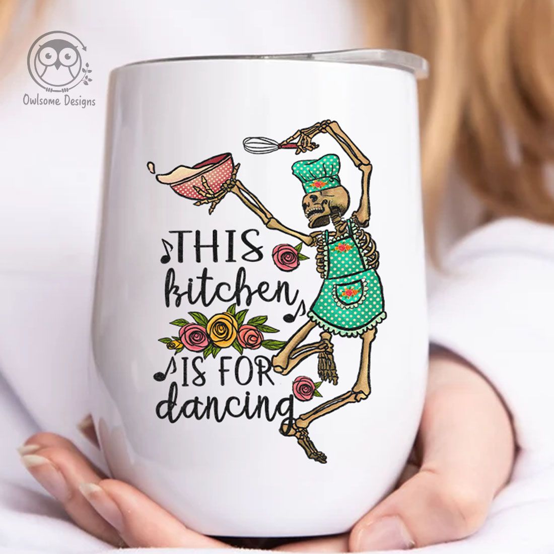 Image of a cup with an enchanting print of a dancing skeleton in the kitchen.
