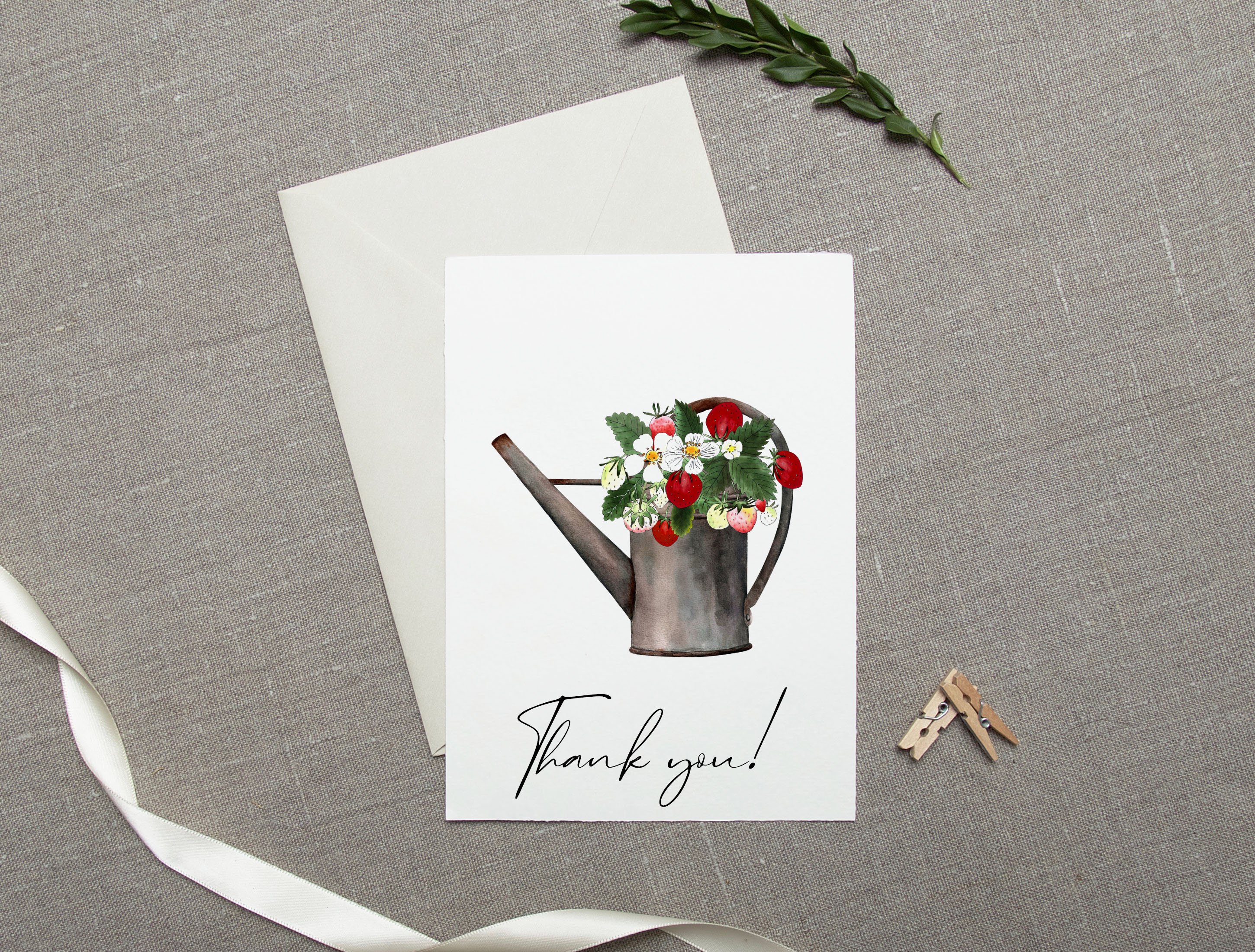 White greeting card with black lettering "Thank you!" and illustration of a strawberry in watering can.