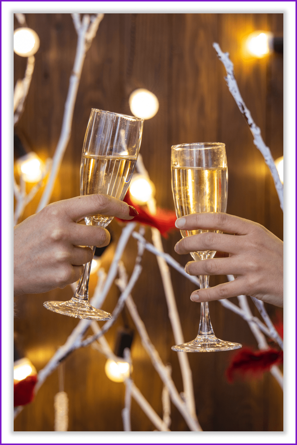 Two hands with glasses of champagne against the background of festive New Year's decorations.