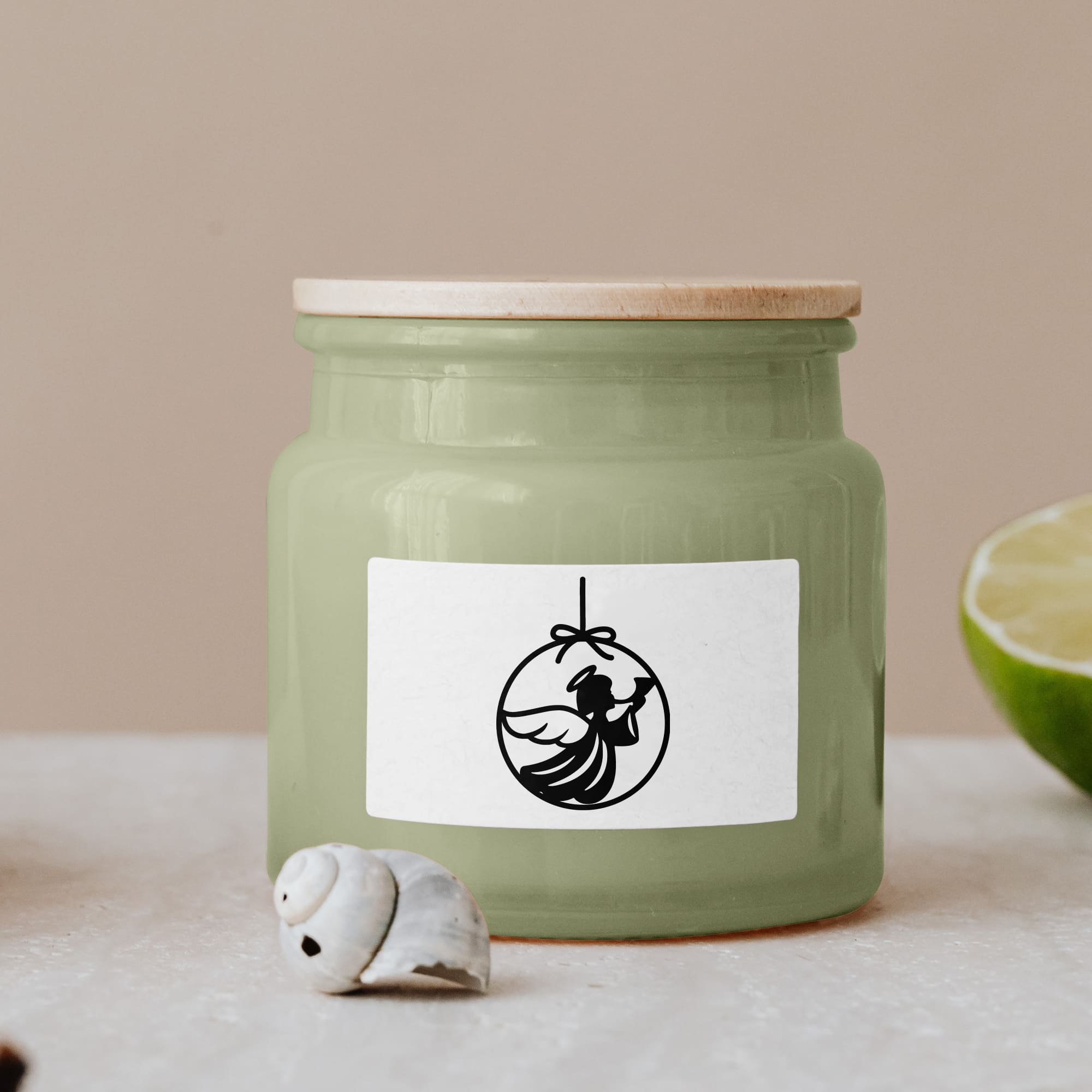 Black christmas illustration on green glass jar with wooden lid.