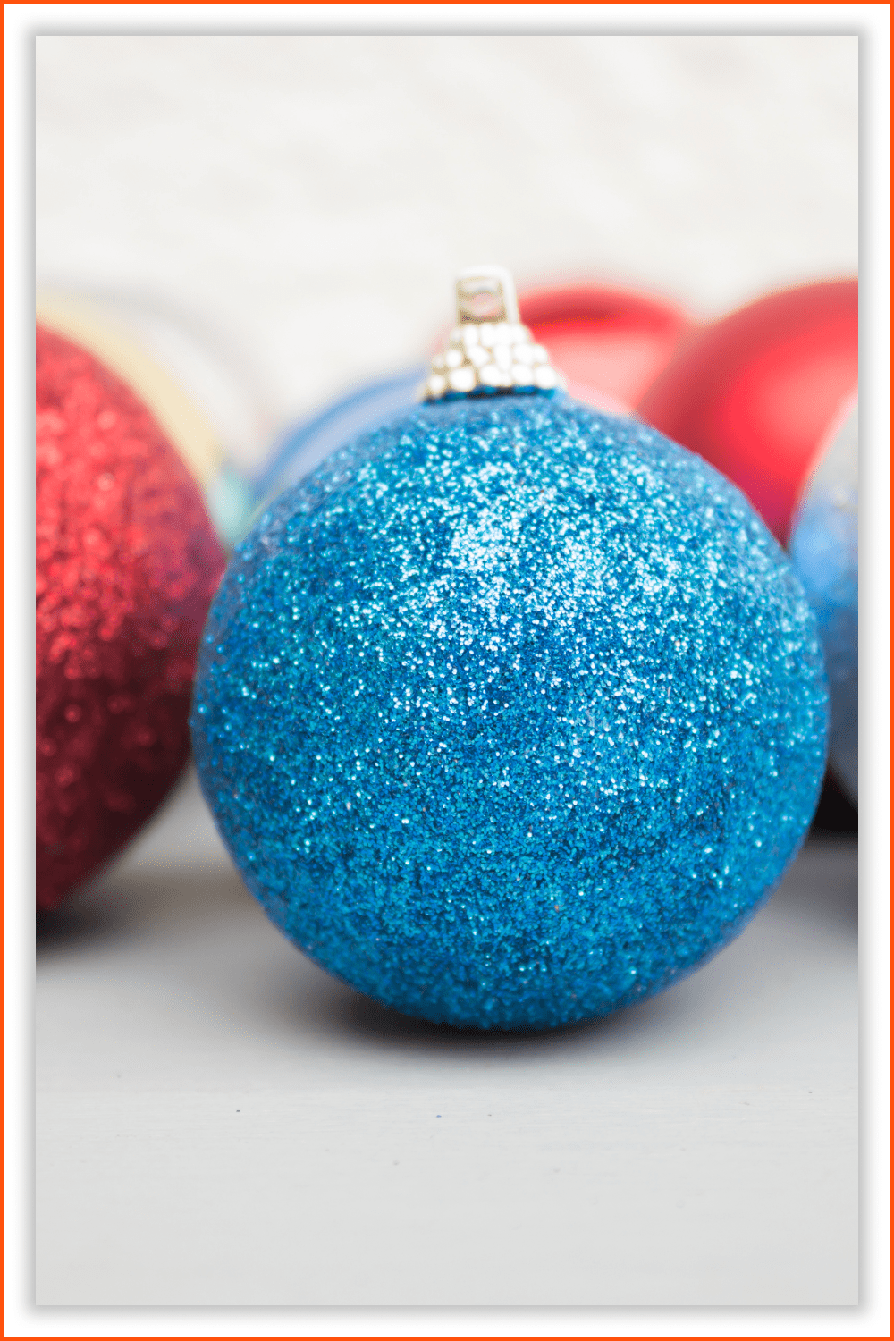 Photo of sparkling blue and red Christmas balls.