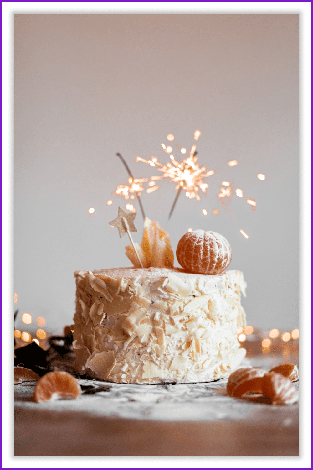 Photo with Cake with mandarins and sparkling sticks.