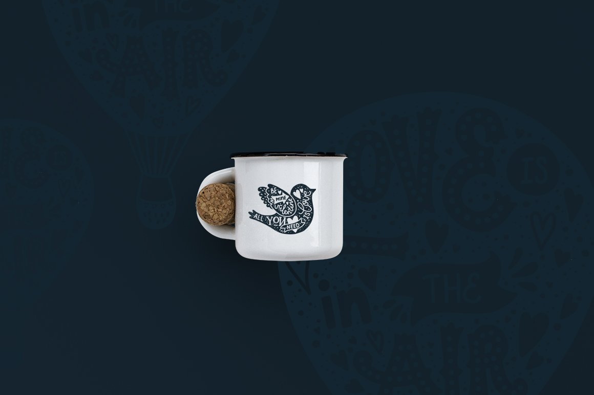 White cup with black illustration of a bird on a dark blue background.