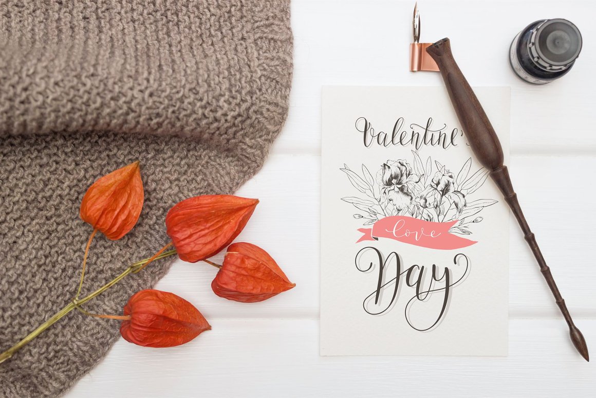 Greeting card with black calligraphic phrase "Valentine's Day".