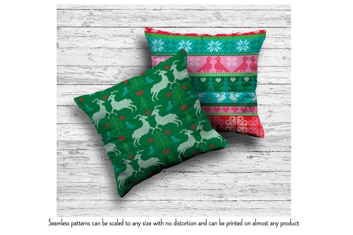 Two pillows with the green and red nordic illustrations.