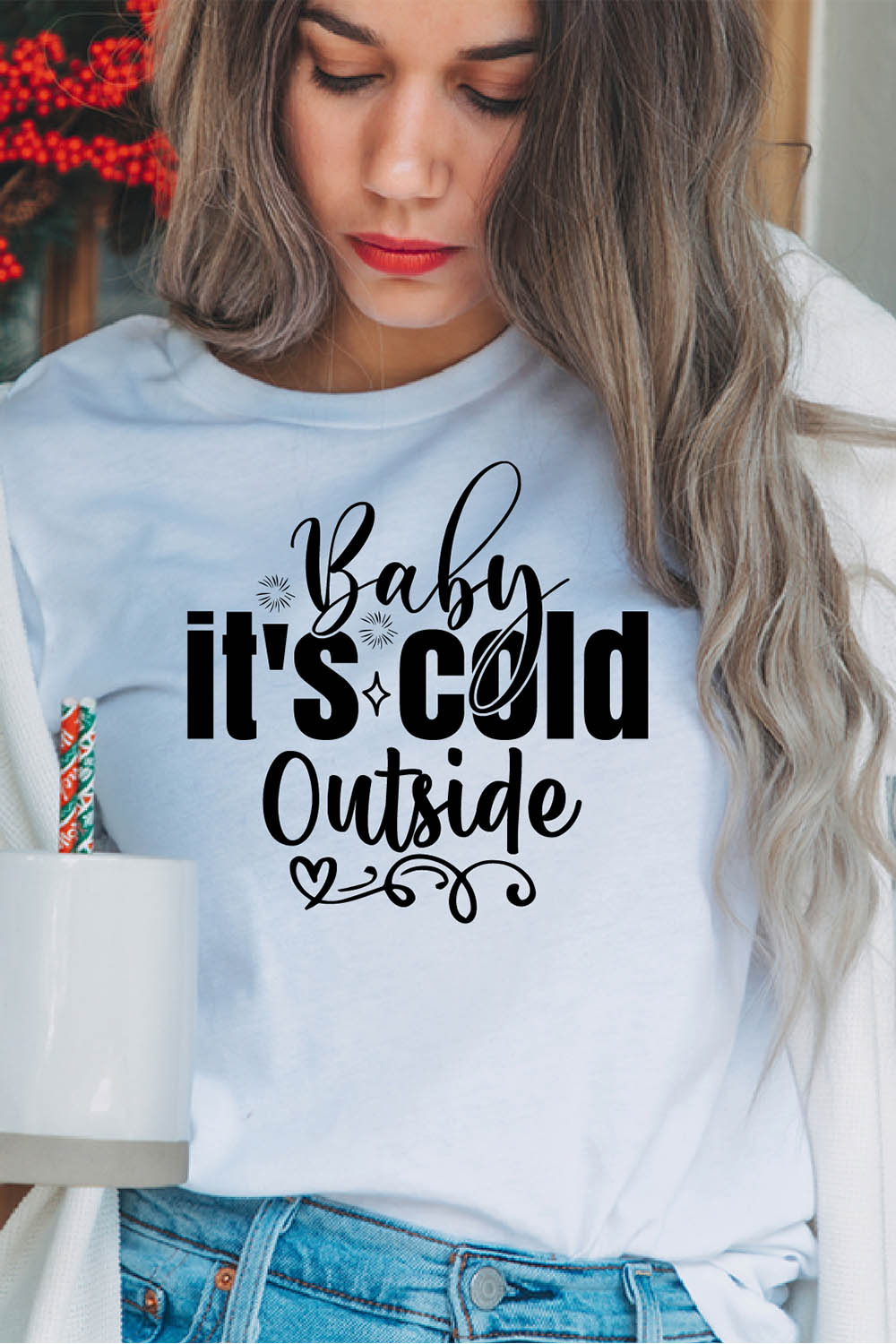 Image of a girl in a white T-shirt with a beautiful black inscription "baby its cold outside".