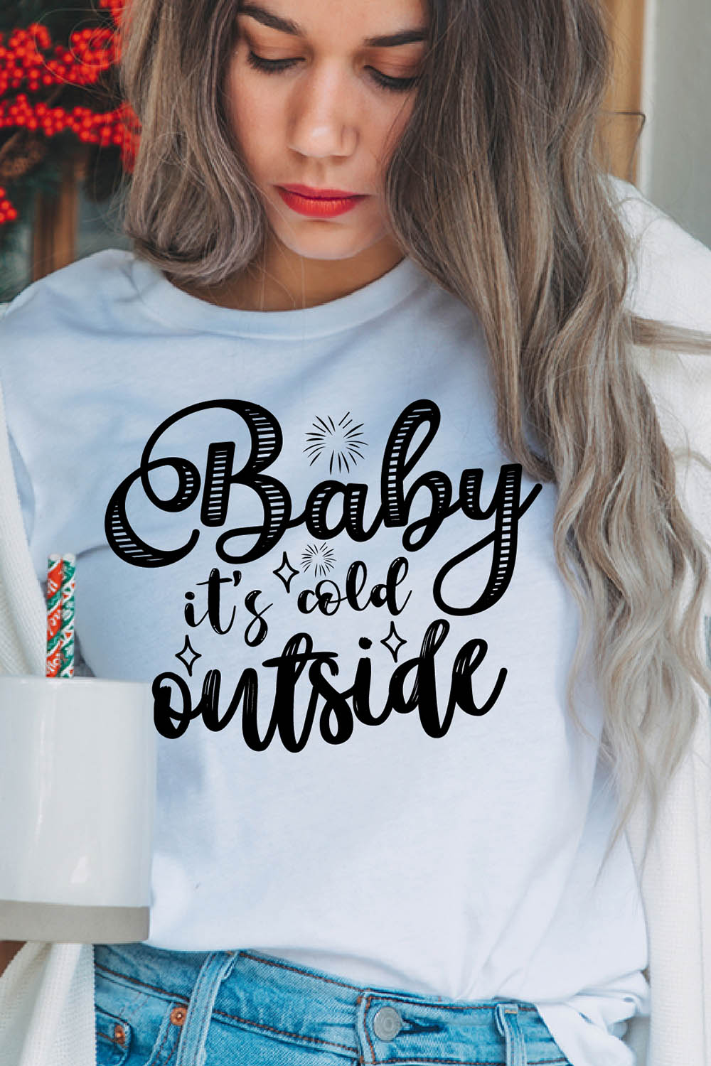 Image of a girl in a white T-shirt with a charming inscription "baby its cold outside".