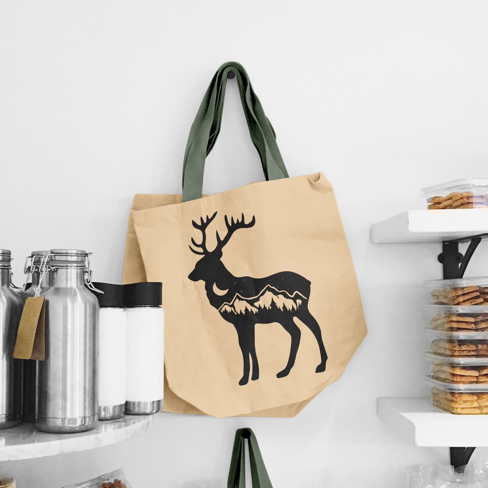 Bag with a deer on it hanging on a wall.