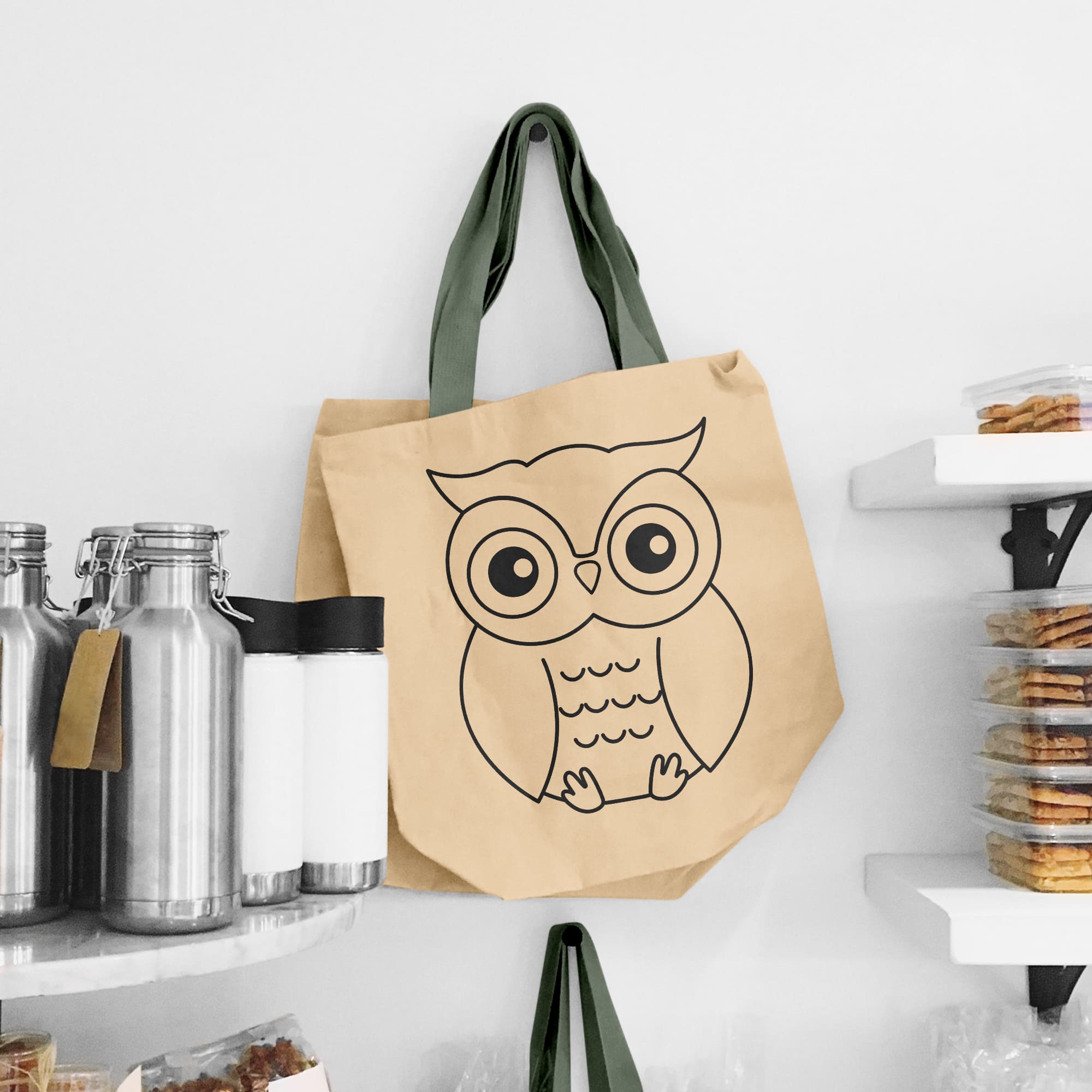 Brown bag with an owl drawn on it.